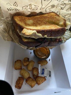 Cuban grilled cheese and tots with tomato soup dipping cup