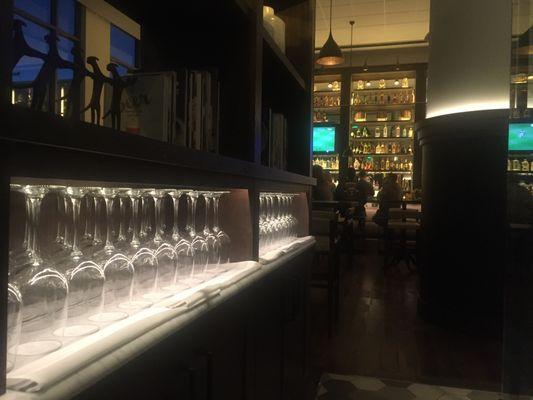 The expansive wine selection at Stella is on display in a glass-enclosed cellar