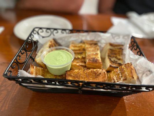 Complimentary bread.. the green sauce is so addicting and delicious on everything.. the heat is unexpected but perfect.