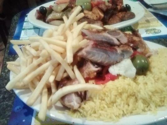 I had the Bar BQ Grilled  half chicken and ribs! This came with french fries and yellow rice. I enjoyed every bit. :o)