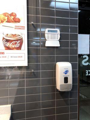 Hand sanitizer station by front door