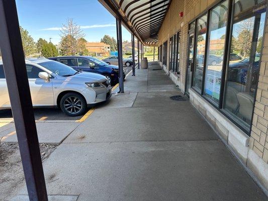 The silver car is theirs and the door is their shop