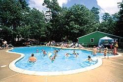 Campground pool with pavilion in the background.