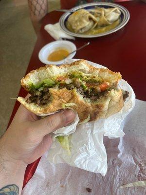 Asada torta with side of habanero sauce