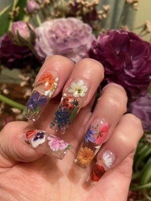 Floral on clear gel x nails.