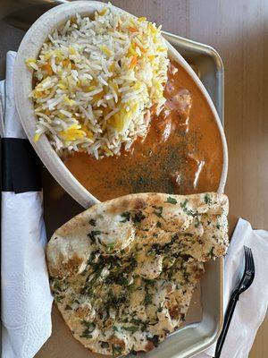 Chicken tikka masala with rice and garlic naan