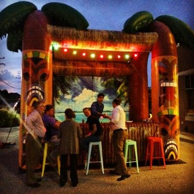 The Inflatable Tiki Bar in a bank parking lot for a networking event