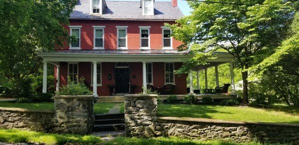 Great front porch at the Hollinger House with plenty of shade and comfortable seating.