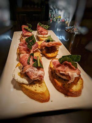 Goat cheese and prosciutto crostini