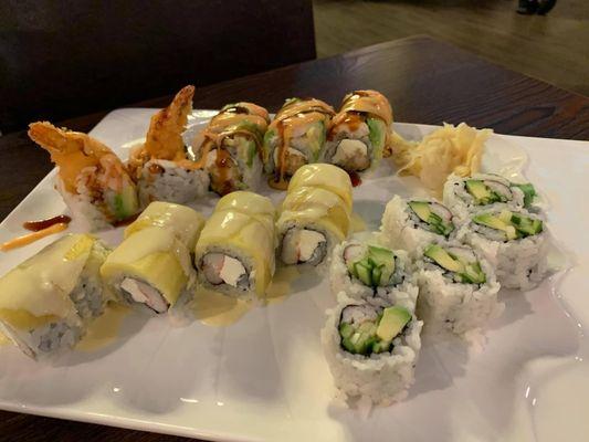 Yummy yummy roll (yellow one), ichiban roll (roll in back of pic), California roll (right side)