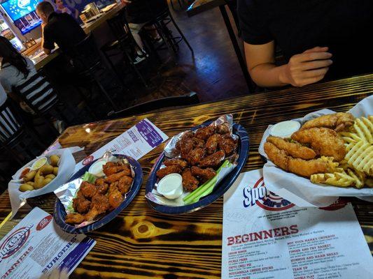 (L to R) mini corn dogs, flaming hot wings, zone sauce wings, finger and fry basket