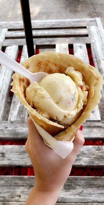 Fruity pebble rice Krispy ice cream inside a waffle cone!!