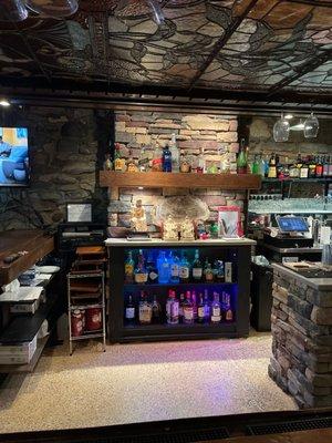 Just one photo of the nicely stocked bar.