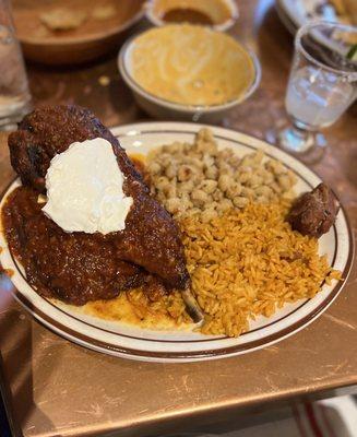 Pollo adobo chicken with rice and pesole