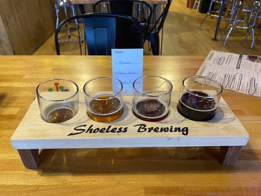 A flight of Spruce, Cranberry Spice, Belgian Quad with Christmas Spices, and PB&J