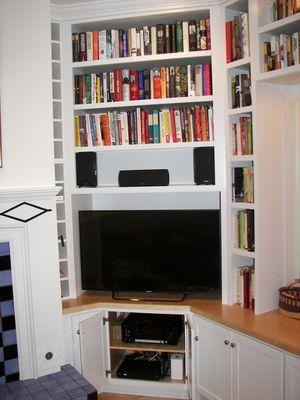 Color Tv entertainment center with white shaker cabinets in Portland, Oregon.