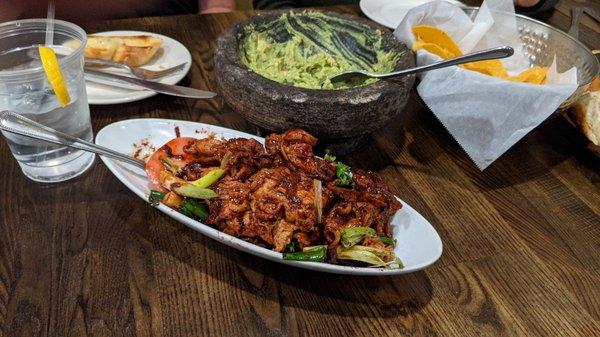 What's left of chips and guacamole and the ginger scallion pork