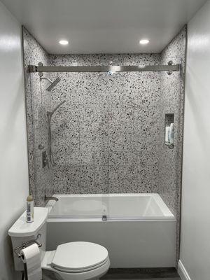 Sorrento series frameless double slider on a tub with 3/8" ultra clear Starfire glass with the Enduro shield coating