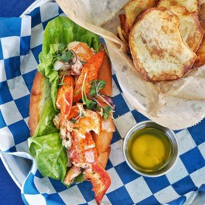 CONNECTICUT STYLE LOBSTAH ROLL with Bibb Lettuce on a Toasted New England Brioche Roll. Served warm with Butter, Homemade Potato Chips.