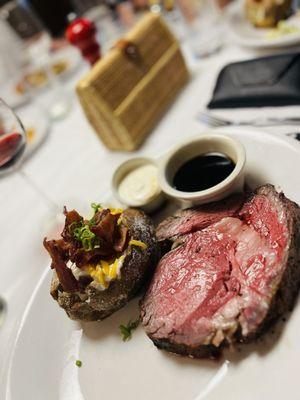 Ribeye bathed in hotel d' maitre butter and as a side a baked potato.