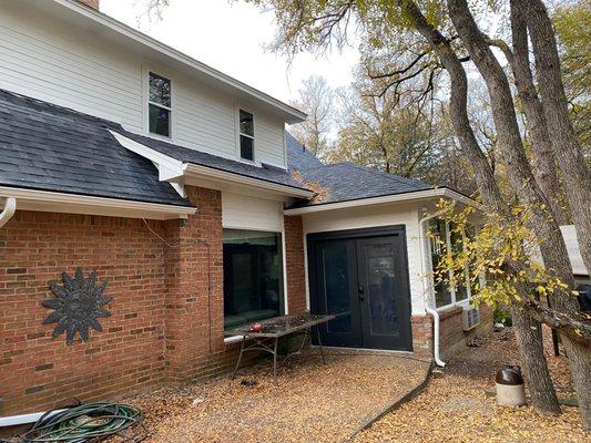 Platinum repaired all the squirrel-chewed soffits, weathered siding, and water-damaged doorframe before painting.