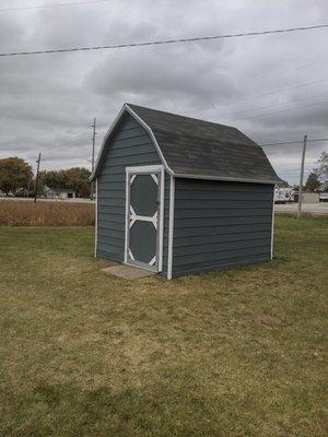 An existing shed with siding and door repairs. This was painted completely. Also a brand new roof installed.