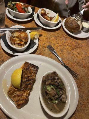 Blackened salmon, burgundy mushrooms, roasted vegetables, scallops, baked potato. We ordered a bit of everything we like this trip.