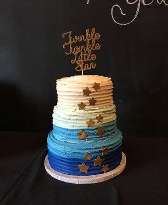 3 tier cake with textured buttercream and fondant stars