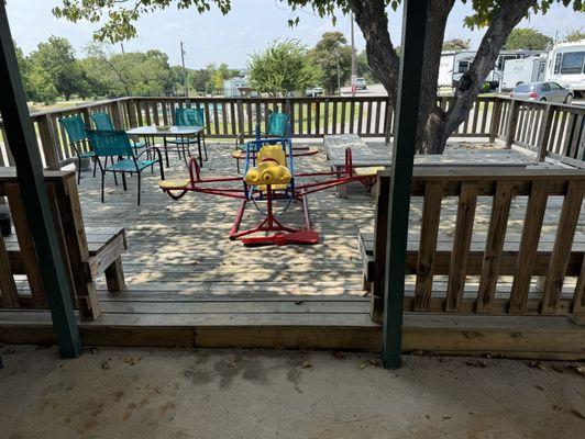 Deck off the gathering area, overlooking the pool