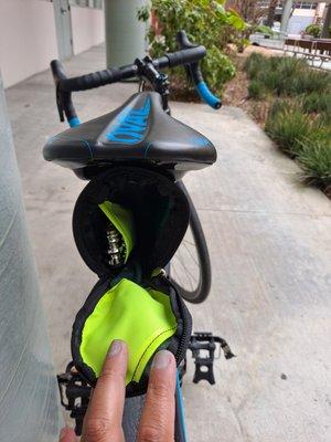 Inside saddle pouch, neon green accents, 2 pockets for tools and my tool. Yeah! Ahh yeah! :^"]