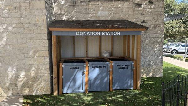 Donation station outside the front entrance for bedding, newspapers, and treats / toys / supplies