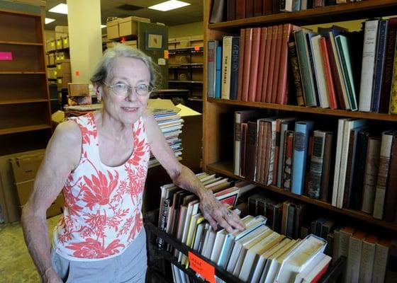 Title Page owner, Beverley Potter, in the stacks. (photo: Pete Bannan for The Main Line Times)