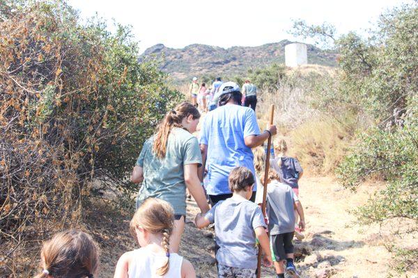 Mermaids live in the Lemonade Tower! Campers hike to the tower to meet the mermaids who share their lemonade.