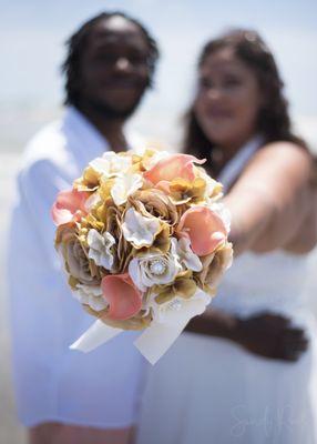 Floral bouquet at a beachside wedding.