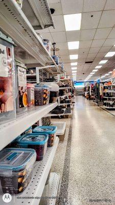 Houseware items, packaged/bottled specialty foods, home furnishings + furniture, down this aisle.