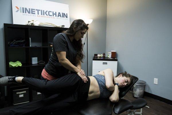 Dr. Galvan using muscle release therapy to induce proper hip mobility.