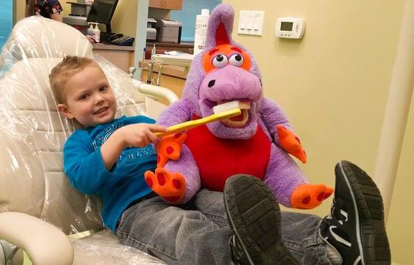 Logan having fun brushing Flossy's teeth at Kids Dental World
 (925) 706-8688