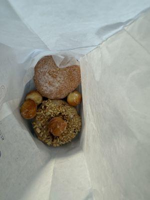 Custard filled sugar donut, doughnut holes and sourdough peanut butter with mixed nuts donut