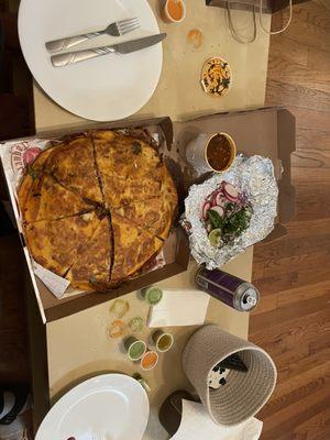 Birria Pizza with the consomé, complimentary sauces and veggies on the side