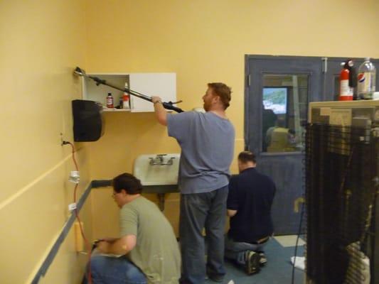 Volunteers repainting and refurbishing our Metro Seattle Gamers club space.