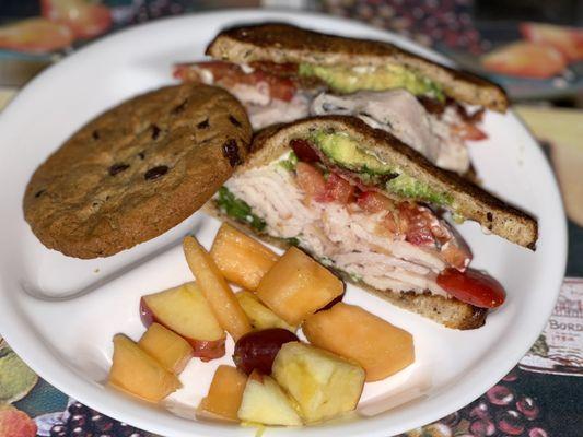 Uptown Turkey Avocado Sandwich, Chocolate Chip cookie & fruits