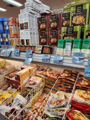 Large variety  of crackers on the top shelf.  Frozen Pasta  on the bottom.