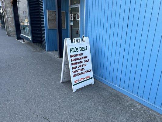 Sign outside on the sidewalk