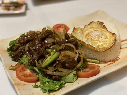 X112 Cubed Beef Steak with onions, fried egg, and white steam rice.