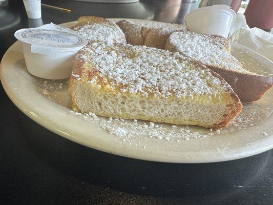 French toast, dry and drenched in powdered sugar to compensate.