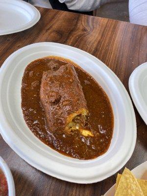 Tamale covered in chili Colorado