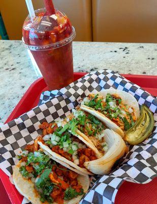 Street tacos: pastor, carnitas, pollo. And a spicy mangoneada.