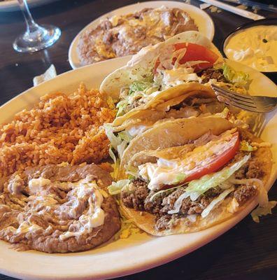 8/31/24 Taco dinner beef no onions. Two corn one flour Extra order of refried beans