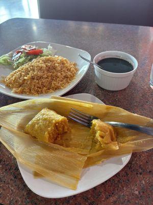 Tamale, black beans, yellow rice, salad.