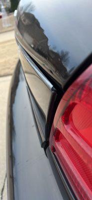 Trunk panel peeling away from car letting water inside